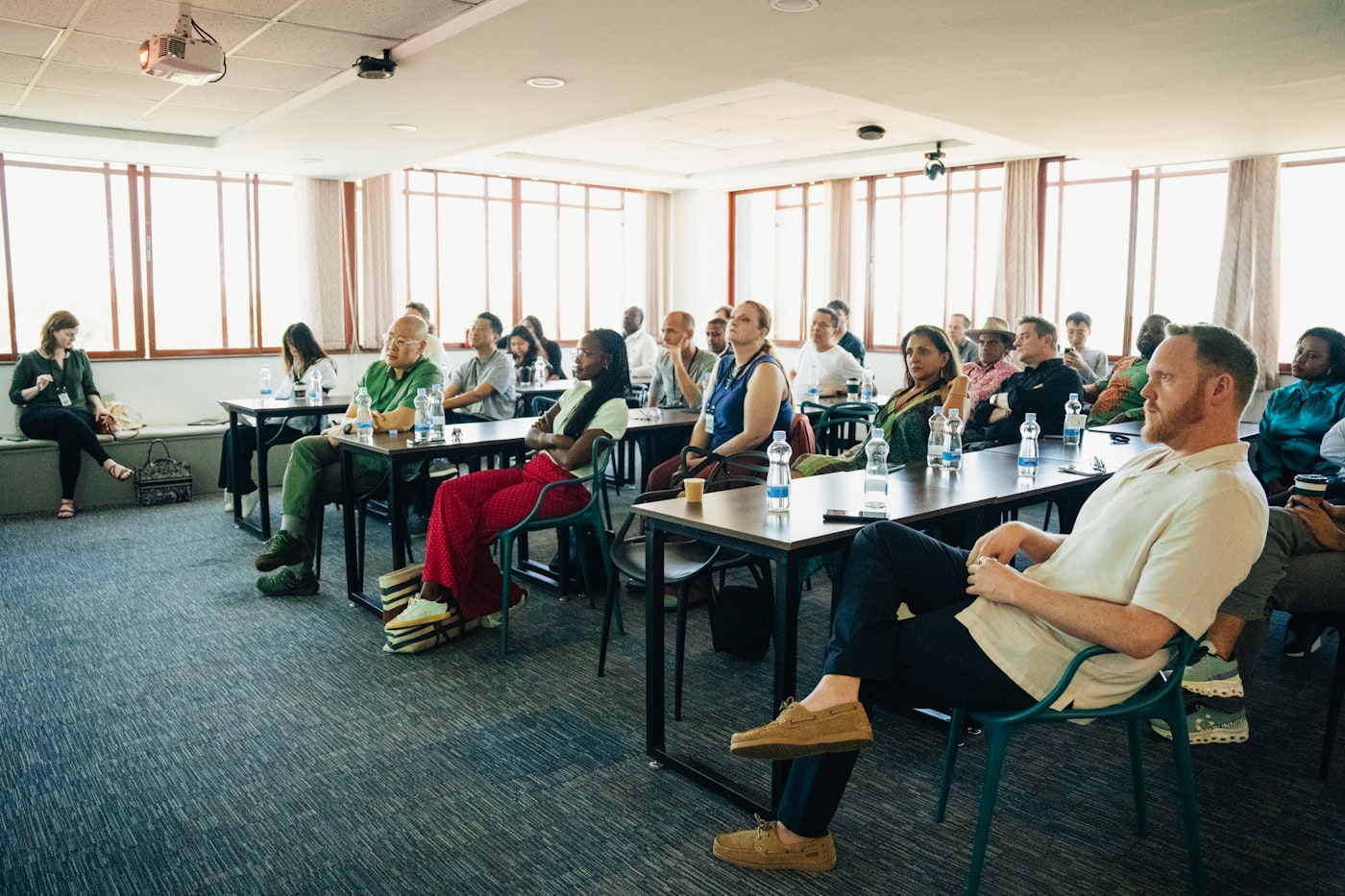 A diverse group of professionals at an in-person training